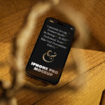Perspective View of iPhone 14 Mockup on Armchair