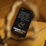 Perspective View of iPhone 14 Mockup on Armchair