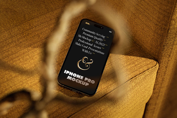 Perspective View of iPhone 14 Mockup on Armchair