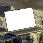 Perspective View of MacBook Mockup on Rock