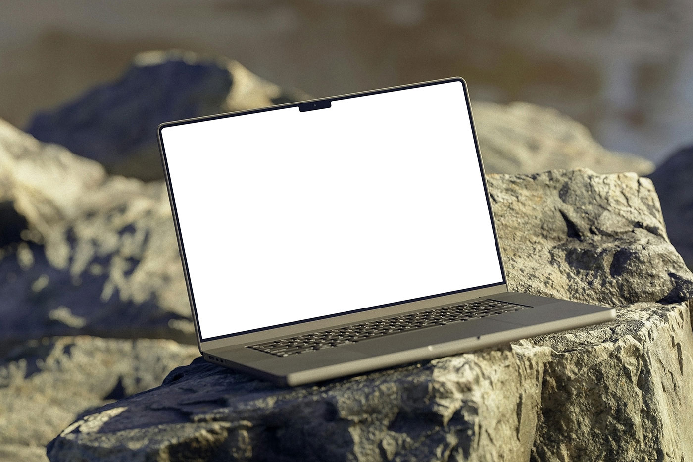 Free Perspective View of MacBook Mockup on Rock PSD Template