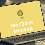 Perspective View of MacBook Mockup on Rock