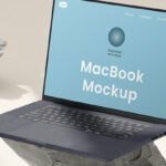 Perspective View of MacBook Mockup on Stone