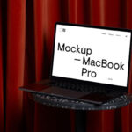 Perspective View of MacBook Pro Mockup on Coffee Table