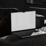Perspective View of MacBook Pro Mockup on Settee