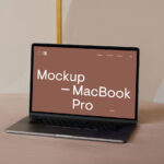 Perspective View of MacBook Pro Mockup on Sofa