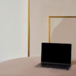 Perspective View of MacBook Pro Mockup on Sofa