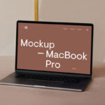 Perspective View of MacBook Pro Mockup on Sofa