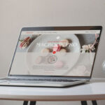 Perspective View of MacBook Pro on Circular Table Mockup