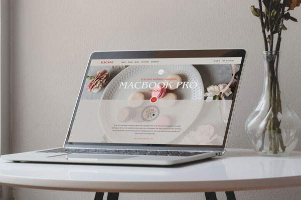 Perspective View of MacBook Pro on Circular Table Mockup