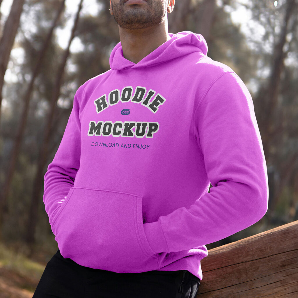 Perspective View of Man Wearing Hoodie Mockup Between Woods