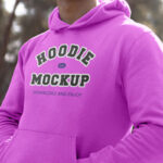 Perspective View of Man Wearing Hoodie Mockup Between Woods