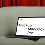 Perspective View of Modern MacBook Pro Mockup on Sofa