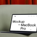 Perspective View of Modern MacBook Pro Mockup on Sofa