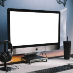 Perspective View of Modern Workstation iMac Mockup in Lifelike Setting