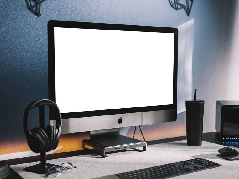 Perspective View of Modern Workstation iMac Mockup in Lifelike Setting