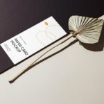 Perspective View of Oblong Paper Card Mockup with Leaf