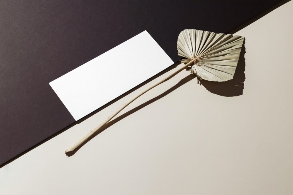 Perspective View of Oblong Paper Card Mockup with Leaf