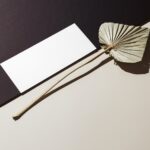 Perspective View of Oblong Paper Card Mockup with Leaf