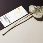 Perspective View of Oblong Paper Card Mockup with Leaf
