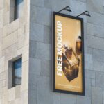 Perspective View of Outdoor Vertical Billboard Mockup on Building