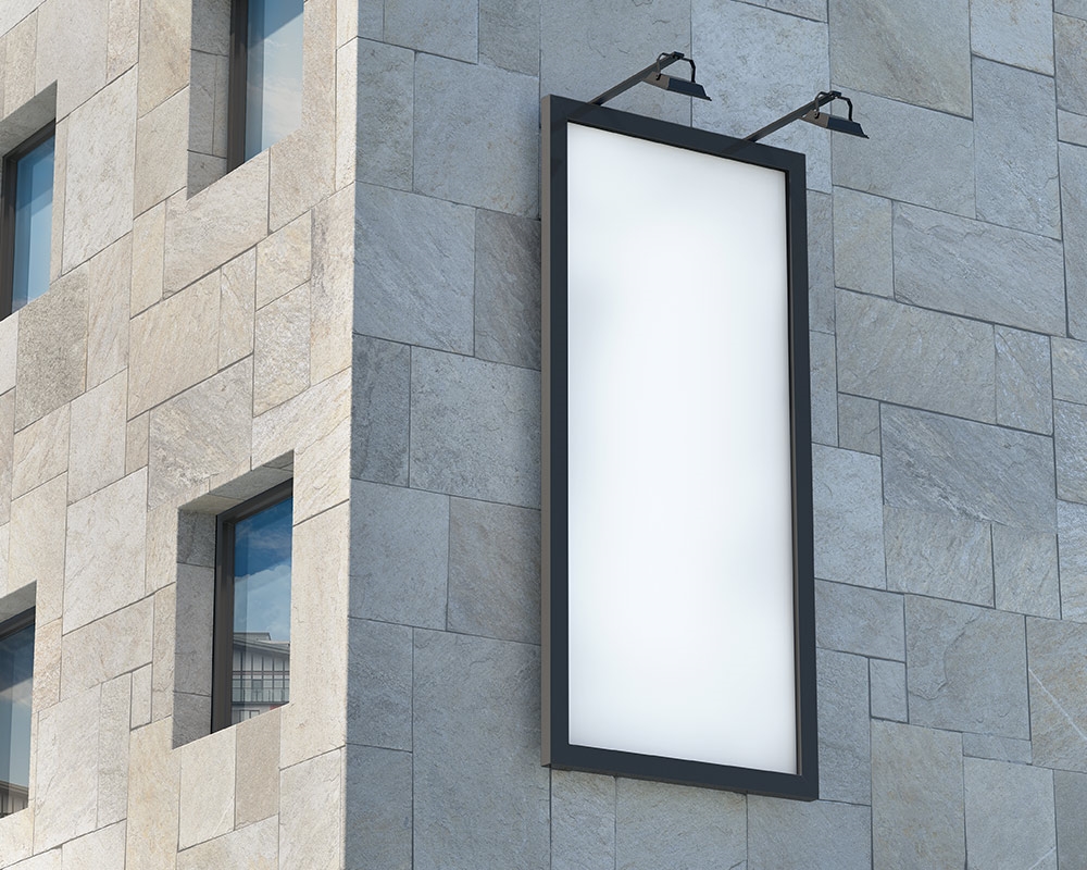 Perspective View of Outdoor Vertical Billboard Mockup on Building