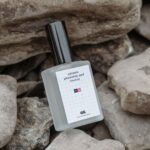 Perspective View of Perfume Bottle Mockup on Rocks