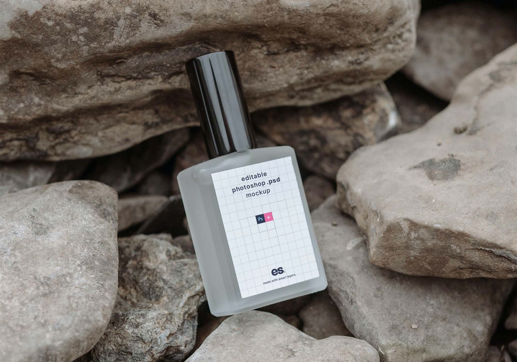 Perspective View of Perfume Bottle Mockup on Rocks FREE PSD