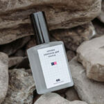 Perspective View of Perfume Bottle Mockup on Rocks