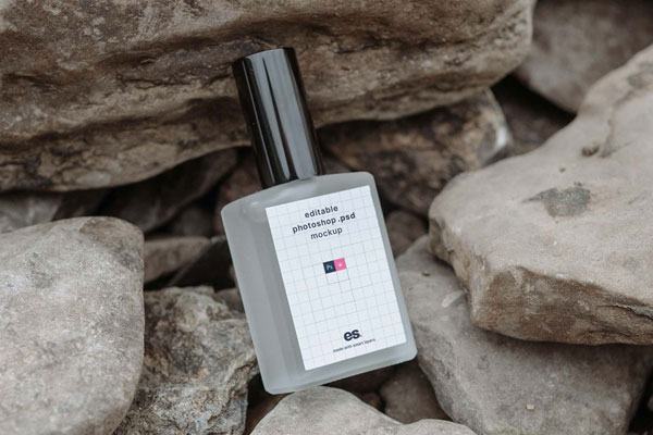 Perspective View of Perfume Bottle Mockup on Rocks