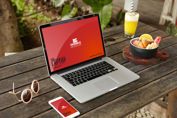 Perspective View of Smartphone and Laptop on Wooden Table Mockup