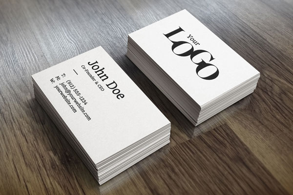 Perspective View of Two Packs of Business Card on Wooden Surface Mockup