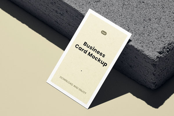 Perspective View of Vertical Business Card Mockup against Brick