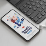 Perspective View Smartphone Mockup with Ear Pods and Keyboard