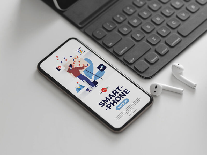 Perspective View Smartphone Mockup with Ear Pods and Keyboard