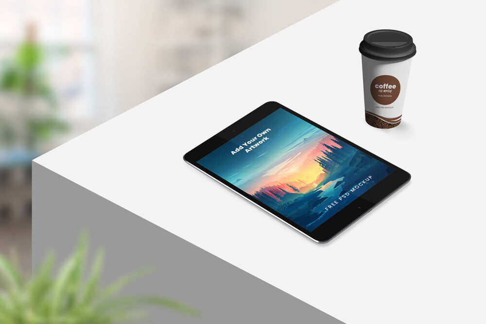 Perspective View Tablet on Table with Coffee Cup Mockup