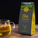 Perspective View Tea Pouch Packaging Mockup with a Glass