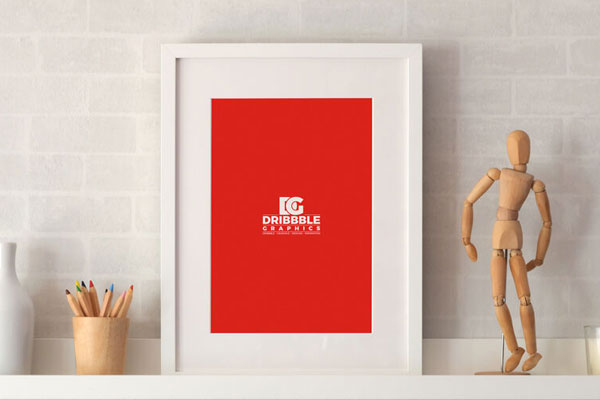 Photo Frame on a Shelf with Pencil and Statue Around Mockup