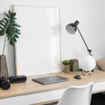 Picture Frame on Desk Mockup with Lamp and Laptop