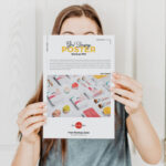 Poster Mockup Featuring a Girl Holding it in the Front View