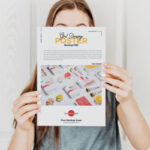 Poster Mockup Featuring a Girl Holding it in the Front View
