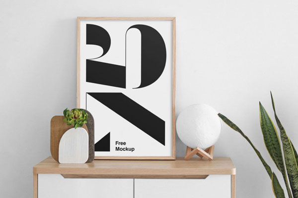 Poster Mockup on a Cabinet Next to a Plant