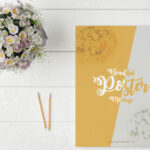 Poster Mockup on Table with Pencils and Flowers