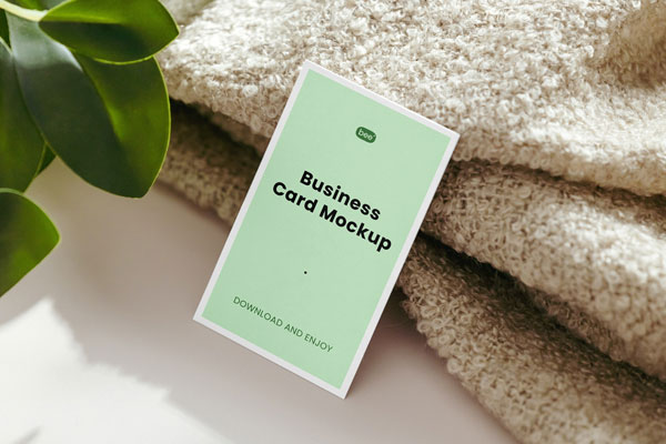 Realistic Business Card Mockup Featuring Blanket and Plant
