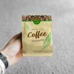 Realistic Mockup Featuring a Hand Holding a Small Coffee Bag