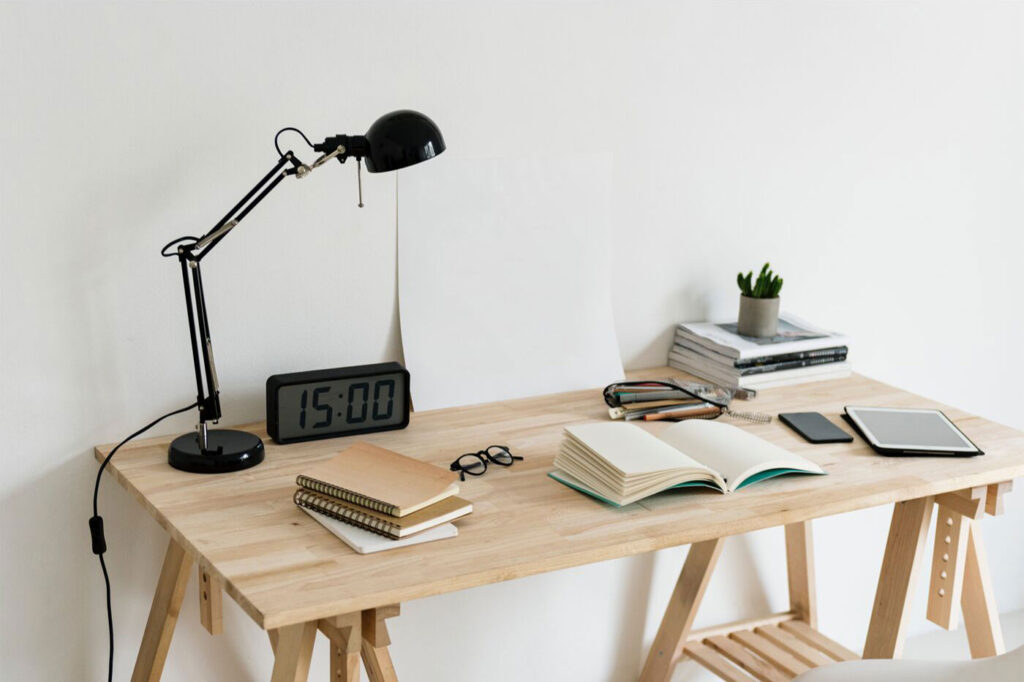 Realistic Mockup Featuring a Poster on a Desk