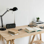 Realistic Mockup Featuring a Poster on a Desk