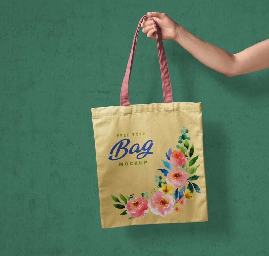 Realistic Mockup of Hand Holding a Tote Bag