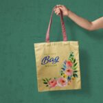 Realistic Mockup of Hand Holding a Tote Bag