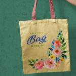 Realistic Mockup of Hand Holding a Tote Bag
